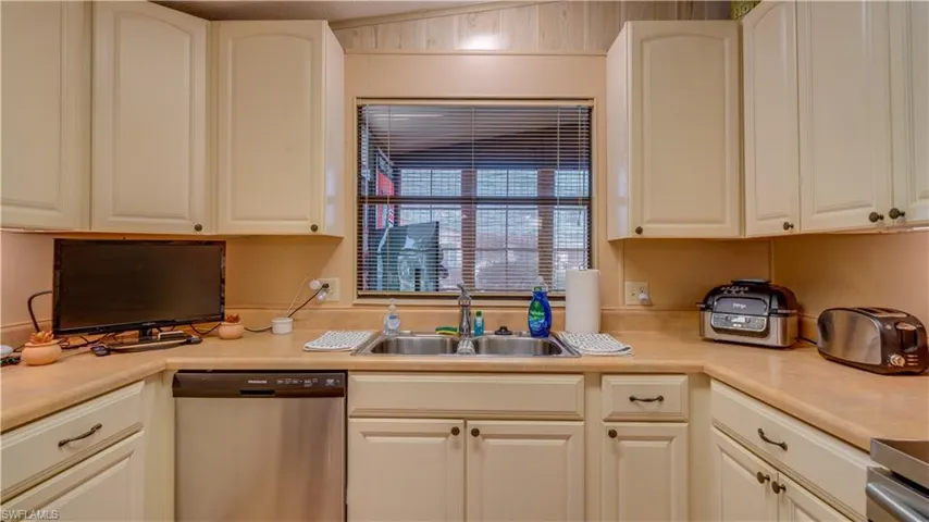 This kitchen, and this home, is great for entertaining. The pass thru window to the lanai, and the new light fixture, are added bonuses.