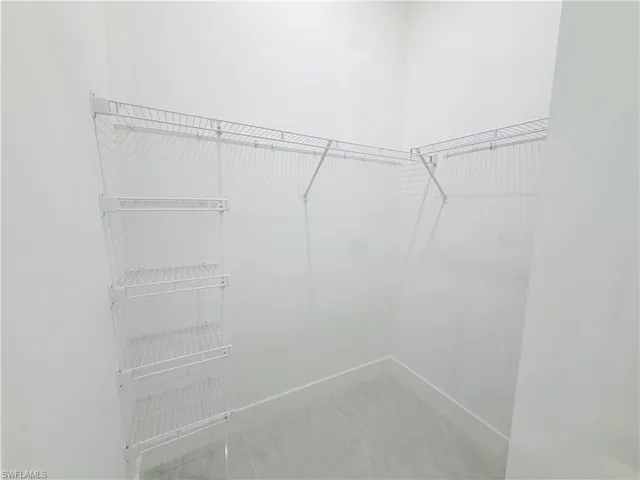 White wire shelving and hanging rods