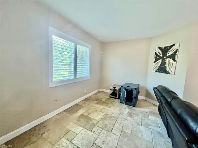 Back portion of living room.