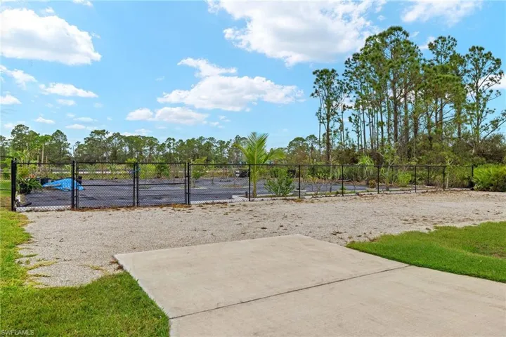 Side lot entryway - double gates and driveway