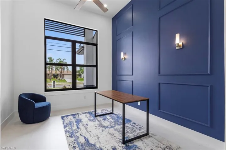 Office area with baseboards and ceiling fan