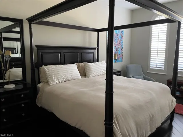 Bedroom featuring wood-type flooring