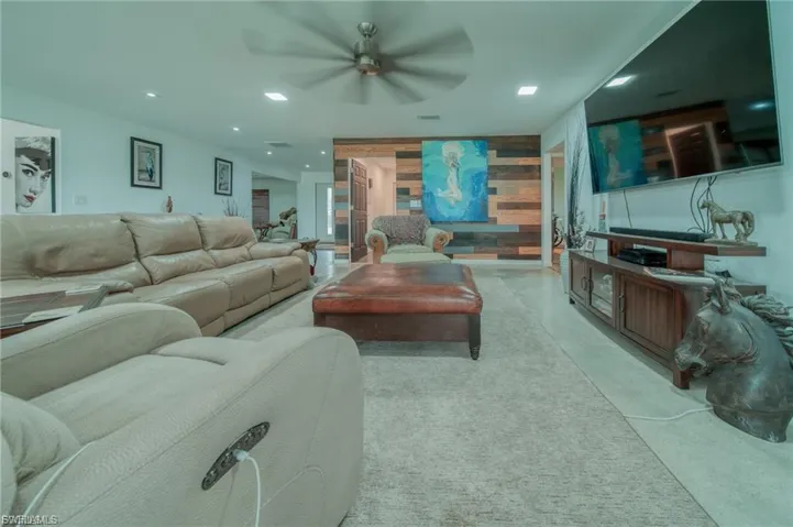 Living room featuring recessed lighting and ceiling fan
