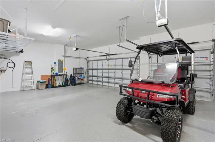 Garage with a garage door opener and electric panel