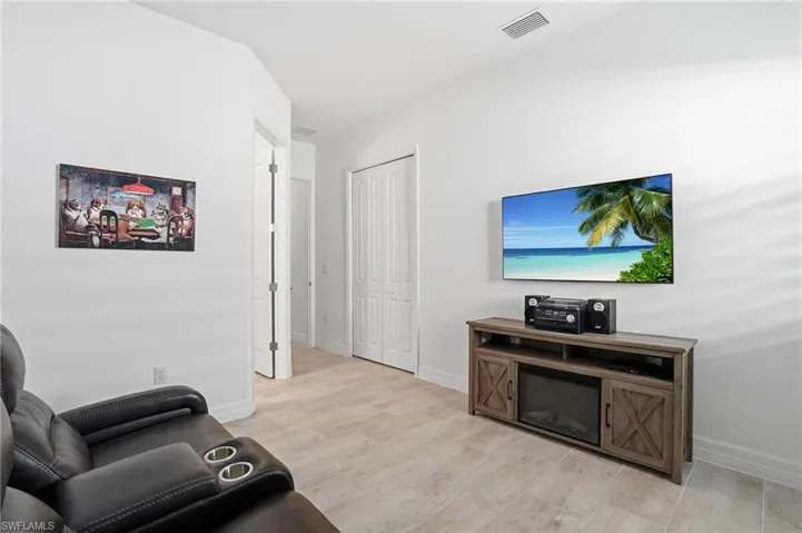Living area featuring light wood finished floors and baseboards