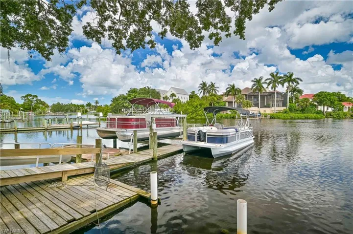 Dock featuring a water view and boat lift