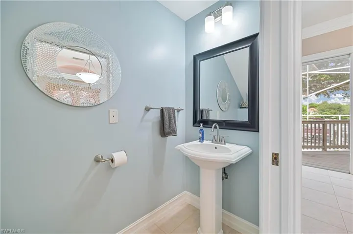 Bathroom featuring tile patterned flooring and ornamental molding