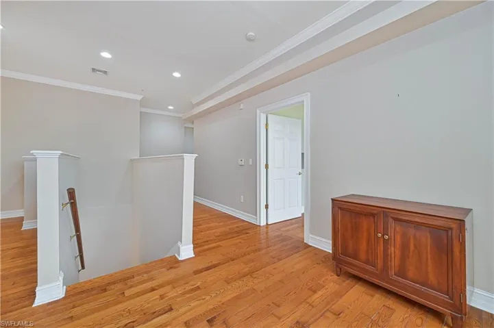 Unfurnished room featuring ornamental molding, recessed lighting, and light wood-style flooring