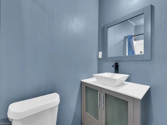 Bathroom with vanity and toilet