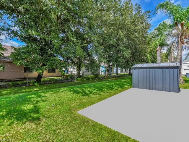 View of yard featuring a storage unit