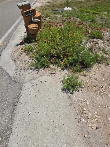 Old mailbox post with house number
