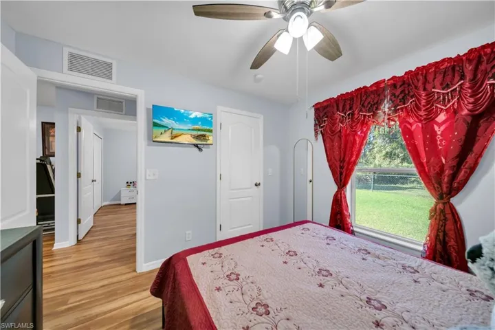 Bedroom featuring light wood-type flooring and a ceiling fan