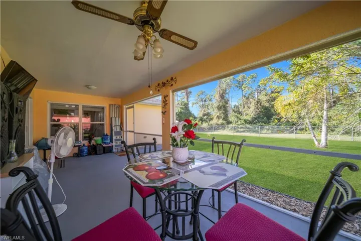 View of patio featuring outdoor dining space and ceiling fan