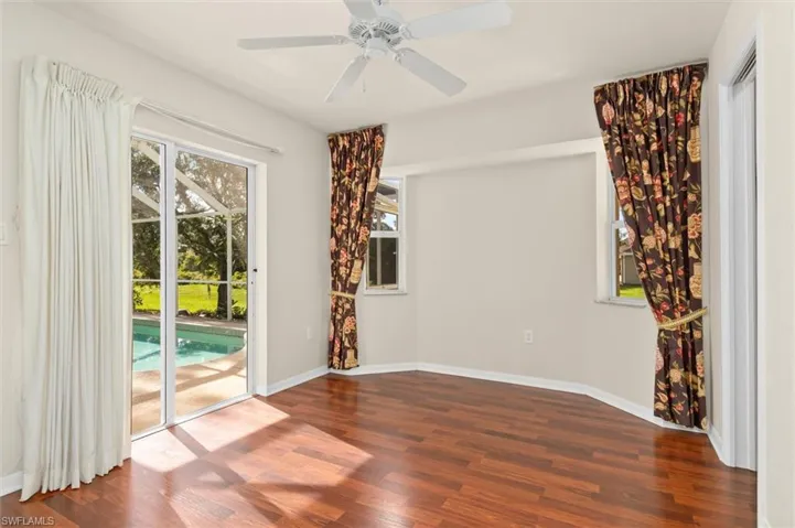 Bedroom #3 featuring ceiling fan wood-style floors