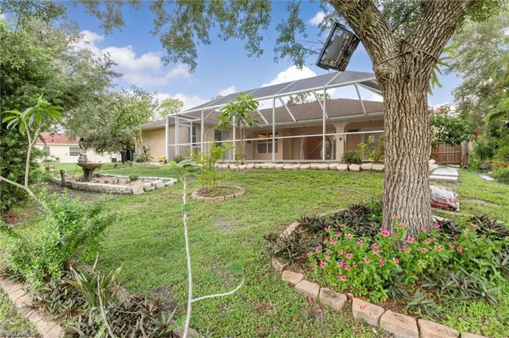 View of yard featuring a lanai