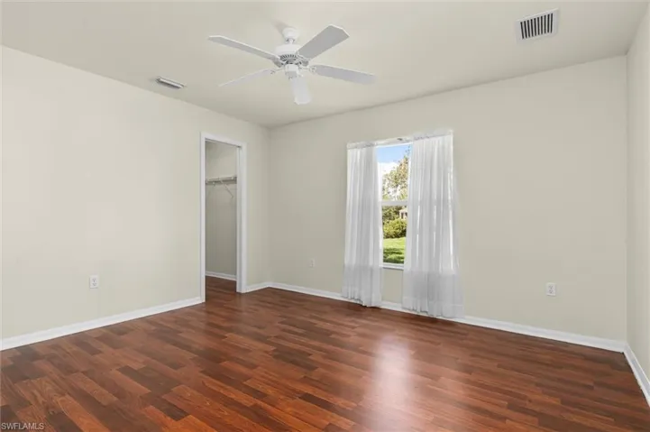 Bedroom#2 with ceiling fan and wood-style flooring