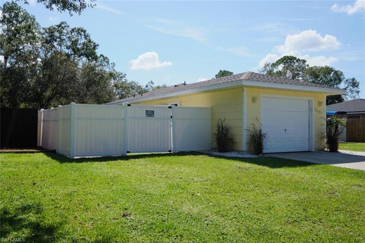 Fenced area to left of garage