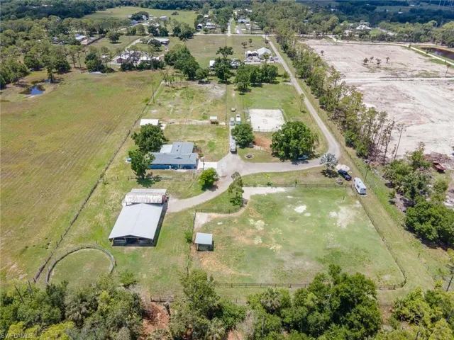 From the North Acreage behind 5 acres with long driveway gated and offering safety from road