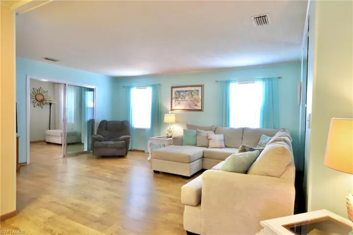 Living room with light hardwood / wood-style floors