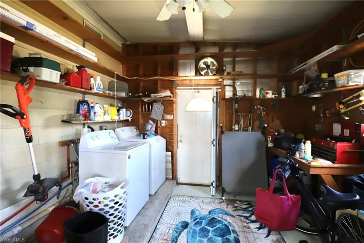 Laundry room featuring washer and clothes dryer and ceiling fan