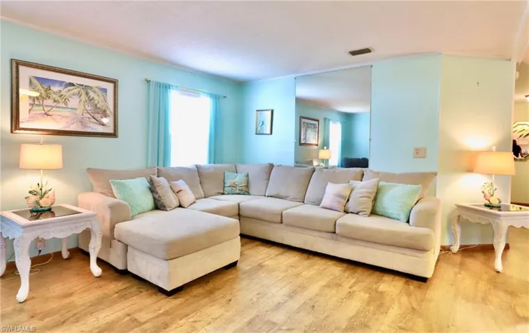 Living room with wood-type flooring
