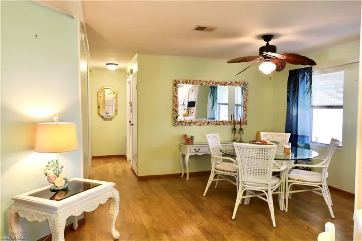 Dining space featuring hardwood / wood-style flooring and ceiling fan