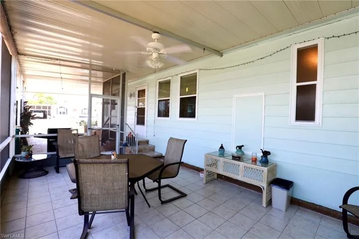 Sunroom featuring ceiling fan