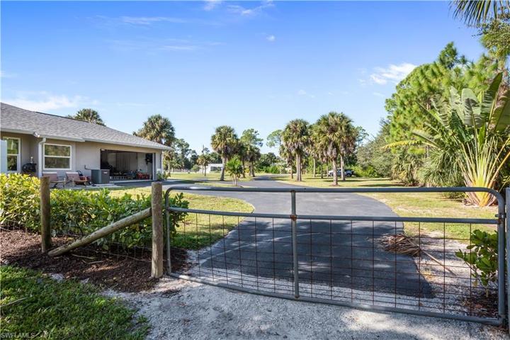 Backyard is fenced with gate to Driveway
