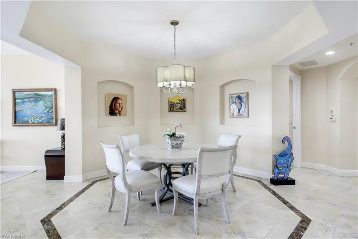 Dining area with a notable chandelier