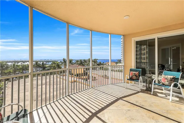 Unfurnished sunroom featuring a water view