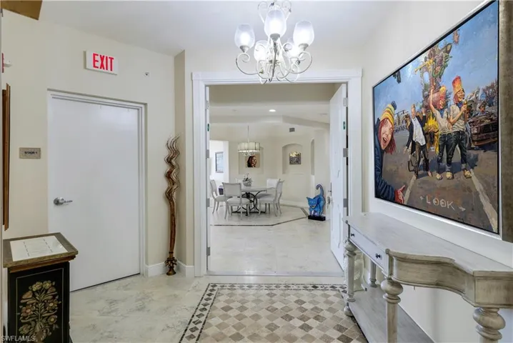 Corridor with a notable chandelier