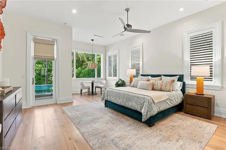 Spacious primary suite designed to accommodate a private office or intimate sitting area with access to the lanai or spa