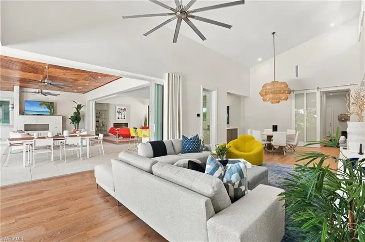 Expansive pocketing doors create a seamless transition between interior living and the covered outdoor spaces.