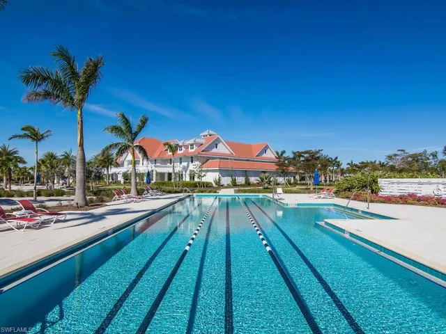 Community pool with a patio