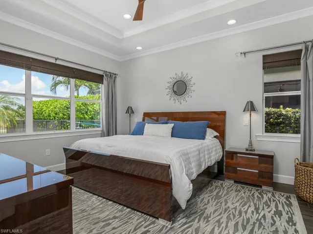 Bedroom featuring recessed lighting, crown molding, baseboards, and ceiling fan