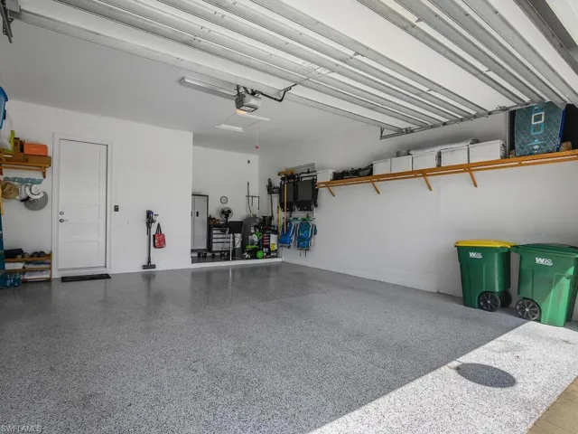 Garage featuring a garage door opener