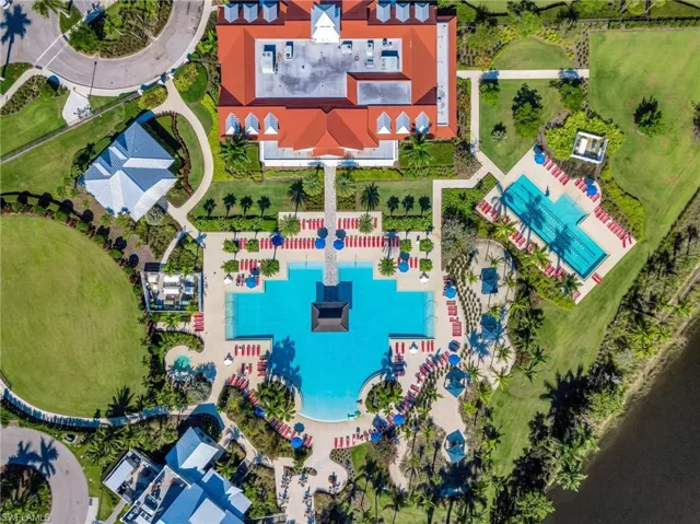 Bird's eye view of a pool area, clubhouse, grounds.