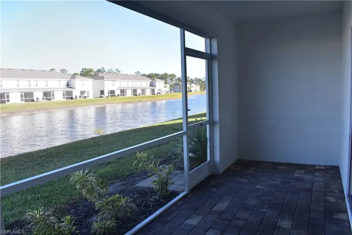 Unfurnished sunroom with a water view