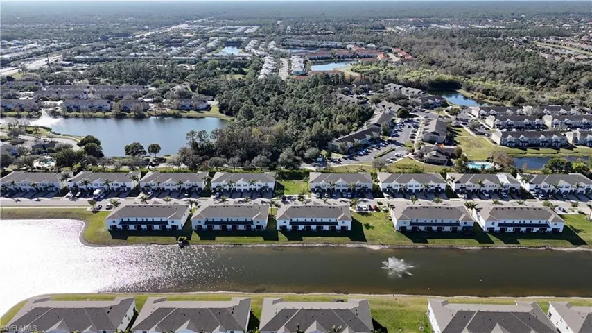 Aerial view of property's location featuring nearby suburban area and a large body of water