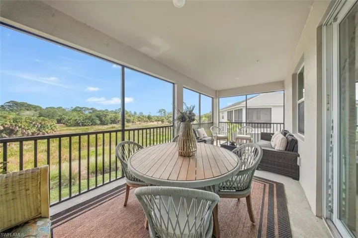 Sunroom / solarium with view of scattered trees
