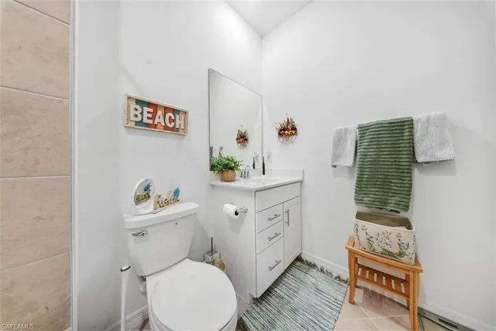 Bathroom with vanity and light tile patterned floors