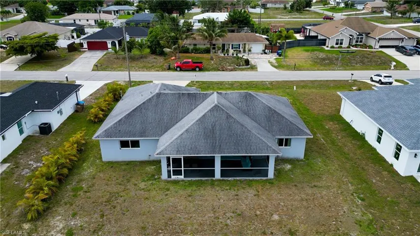 Light blue exterior with gray shingle roofing