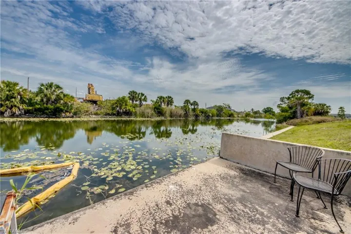 Concrete patio with water frontage, offering direct access to the water