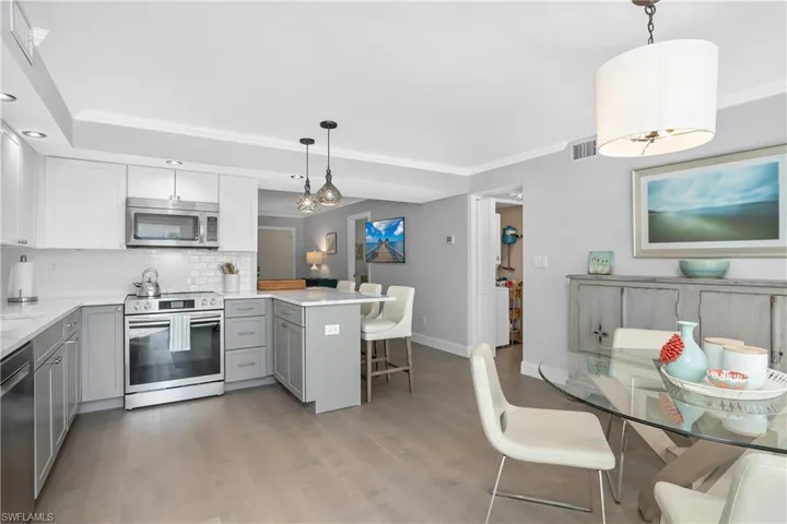 Kitchen with stainless steel appliances and quartz countertops