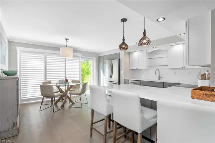 Kitchen with stainless steel appliances and quartz countertops