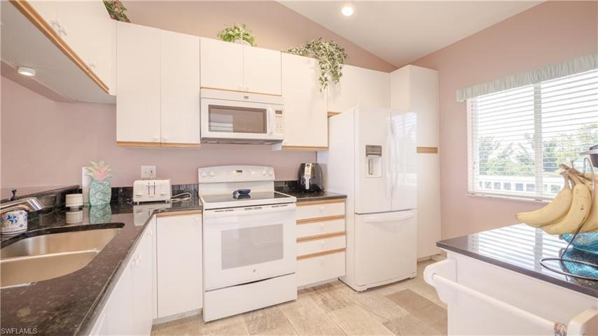 This condo has vaulted ceilings in the kitchen.