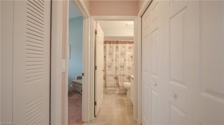 The pocket door into the guest suite allows for privacy and convenience to the 'ensuite' bath. Laundry closet is on the right. Mechanical closet to the left.