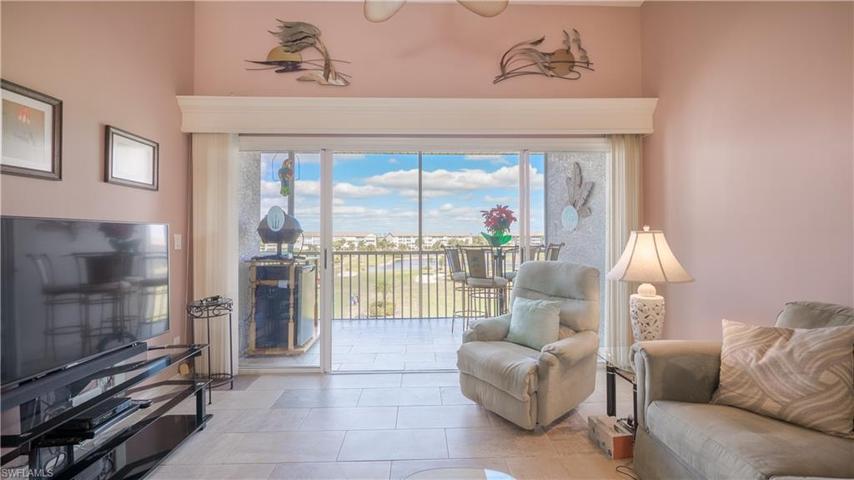 The view of the golf course can be seen from the living room.
