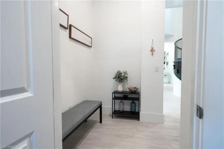Hall featuring light wood finished floors