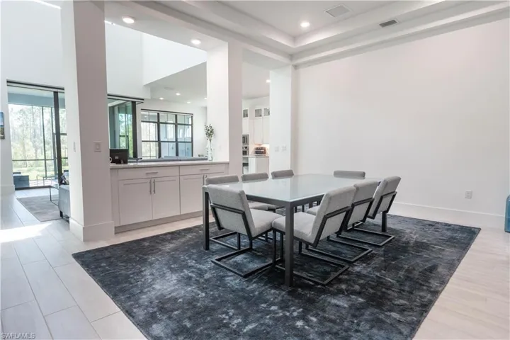 Dining area with baseboards, recessed lighting, light wood-style floors, and visible vents